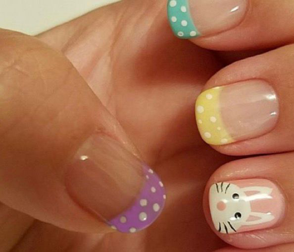 French tip nails with pastel polka dots and bunny face design