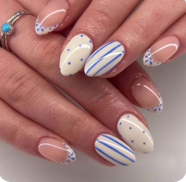 Blue and white spring nails with stripes and polka dots