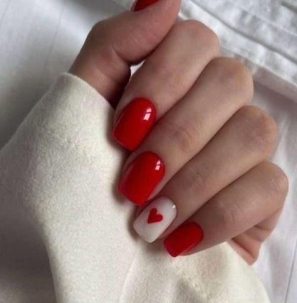 Classic red nails with white accent nail and single red heart